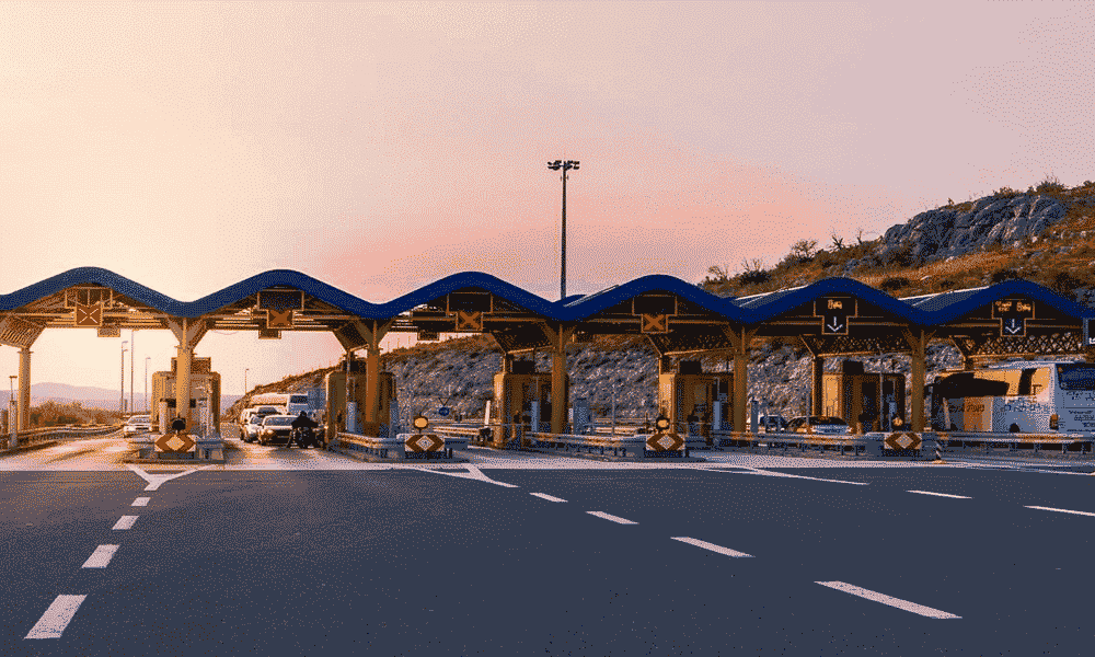 A traffic management terminal toll road at sunset